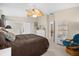 Main bedroom with king bed and access to ensuite bath at 4264 Wordsworth Way, Venice, FL 34293