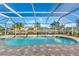 Relaxing kidney-shaped pool with screened enclosure at 4264 Wordsworth Way, Venice, FL 34293