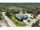 Aerial view of a single-Gathering home with a three-car garage at 436 Hoffer St, Port Charlotte, FL 33953