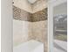 Bathroom with shower/tub combo and exterior access at 4363 Hamwood St, North Port, FL 34287