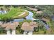 Aerial view showcasing home and golf course views at 4619 Forest Wood Trl # 7, Sarasota, FL 34241