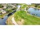 Aerial view of golf course and waterfront property at 4619 Forest Wood Trl # 7, Sarasota, FL 34241