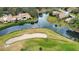 Aerial view of waterfront homes and golf course at 4619 Forest Wood Trl # 7, Sarasota, FL 34241