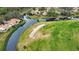 Aerial view of home near golf course and water at 4619 Forest Wood Trl # 7, Sarasota, FL 34241