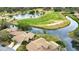 Aerial view of home situated by golf course and water at 4619 Forest Wood Trl # 7, Sarasota, FL 34241