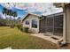Charming patio with screened enclosure and lush landscaping at 4619 Forest Wood Trl # 7, Sarasota, FL 34241