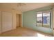 Well-lit bedroom with window and double door closet at 4619 Forest Wood Trl # 7, Sarasota, FL 34241