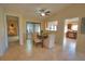 Bright dining room with table and chairs, open to kitchen and living room at 4619 Forest Wood Trl # 7, Sarasota, FL 34241