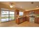 Bright kitchen with wood cabinets and granite counters at 4619 Forest Wood Trl # 7, Sarasota, FL 34241