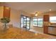 Granite kitchen island with view of backyard and golf course at 4619 Forest Wood Trl # 7, Sarasota, FL 34241