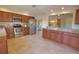 Bright kitchen with stainless steel appliances and granite countertops at 4619 Forest Wood Trl # 7, Sarasota, FL 34241