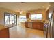 Updated kitchen with wood cabinets, granite counters, and stainless steel appliances at 4619 Forest Wood Trl # 7, Sarasota, FL 34241