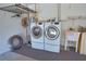 Well-lit laundry room with washer, dryer, and utility sink at 4619 Forest Wood Trl # 7, Sarasota, FL 34241