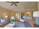 Open living room with high ceilings and built-in wet bar at 4619 Forest Wood Trl # 7, Sarasota, FL 34241