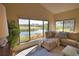 Living room with serene water views at 4619 Forest Wood Trl # 7, Sarasota, FL 34241