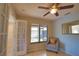 Bright office features built-in shelving and French doors at 4619 Forest Wood Trl # 7, Sarasota, FL 34241