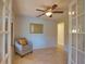 Relaxing sitting area with tiled floors and French doors at 4619 Forest Wood Trl # 7, Sarasota, FL 34241