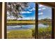 Peaceful water view of golf course and pond from window at 4619 Forest Wood Trl # 7, Sarasota, FL 34241