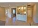 Built-in wet bar with glass-front cabinets at 4619 Forest Wood Trl # 7, Sarasota, FL 34241