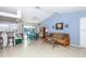 Open living room and kitchen with a view of the pool at 4695 W Price Blvd, North Port, FL 34286