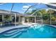 This home features a large, screened pool with extended patio at 4695 W Price Blvd, North Port, FL 34286