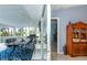 Relaxing screened patio with dining area and access to the kitchen at 4695 W Price Blvd, North Port, FL 34286