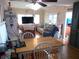 Dining area with wood table and white chairs at 476 Boxwood Dr, Venice, FL 34285