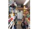 Laundry and workshop area with washer, dryer, and storage shelves at 476 Boxwood Dr, Venice, FL 34285