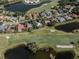 An aerial view of a house and golf course community at 487 Summerfield Way, Venice, FL 34292