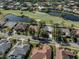 Aerial view of a house on a golf course community at 487 Summerfield Way, Venice, FL 34292