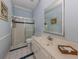 Clean bathroom with shower and updated vanity at 487 Summerfield Way, Venice, FL 34292
