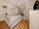 Guest bedroom with striped bedding and sliding glass doors to patio at 487 Summerfield Way, Venice, FL 34292