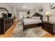 Spacious Primary bedroom with hardwood floors and large windows at 487 Summerfield Way, Venice, FL 34292