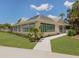 Modern community center with large windows and landscaping at 487 Summerfield Way, Venice, FL 34292