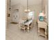 Elegant dining room with a chandelier and large windows at 487 Summerfield Way, Venice, FL 34292
