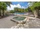 Relaxing hot tub surrounded by lush landscaping at 487 Summerfield Way, Venice, FL 34292