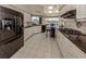 Modern kitchen, granite countertops, white cabinets, and black appliances at 487 Summerfield Way, Venice, FL 34292