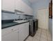 Laundry room with washer, dryer, and ample counter space at 487 Summerfield Way, Venice, FL 34292