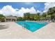 Inviting community pool with plenty of lounge chairs at 487 Summerfield Way, Venice, FL 34292
