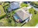Aerial view of home with pool and screened enclosure at 49 Perimeter Dr, Englewood, FL 34223