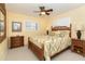 Guest bedroom with bamboo bed frame and tropical decor at 49 Perimeter Dr, Englewood, FL 34223
