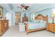 Serene bedroom with light blue walls and a wooden bed frame at 49 Perimeter Dr, Englewood, FL 34223