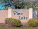 Community entrance sign for Pine Lake at 49 Perimeter Dr, Englewood, FL 34223