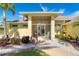 Enclosed porch with seating and view to the main entrance at 49 Perimeter Dr, Englewood, FL 34223