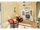 Entryway with wicker chairs and view into the living room at 49 Perimeter Dr, Englewood, FL 34223