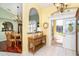 Bright and airy entryway with view of dining room and sunroom at 49 Perimeter Dr, Englewood, FL 34223