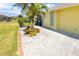 Landscaped yard with gravel and tropical plants at 49 Perimeter Dr, Englewood, FL 34223