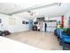 Two-car garage with ample storage and workshop area at 49 Perimeter Dr, Englewood, FL 34223