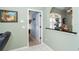 View down hallway from dining room, showing access to other rooms at 49 Perimeter Dr, Englewood, FL 34223