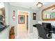 Home office features built-in desk and view into hallway at 49 Perimeter Dr, Englewood, FL 34223